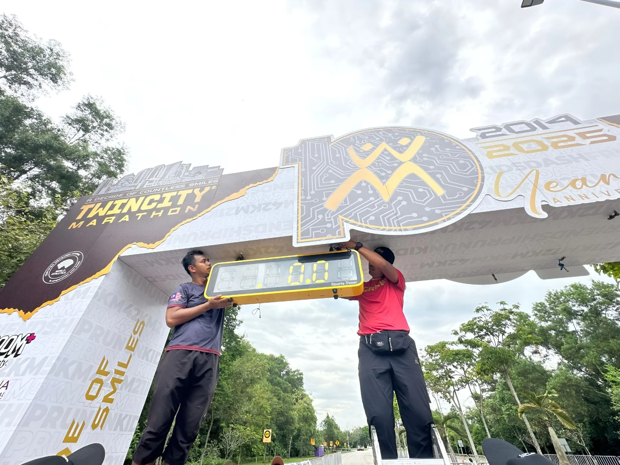 TIZ Events crew installing a custom-fabricated race arch