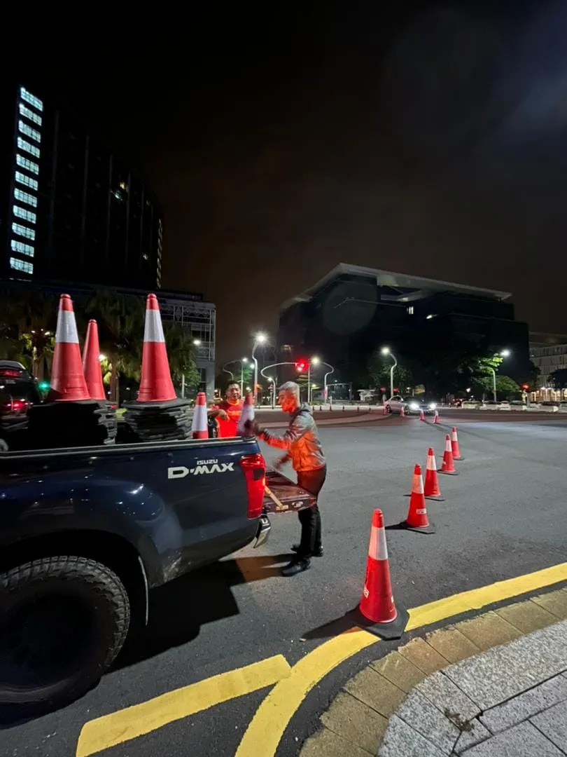 Night-time traffic cone deployment by TIZ Events crew
