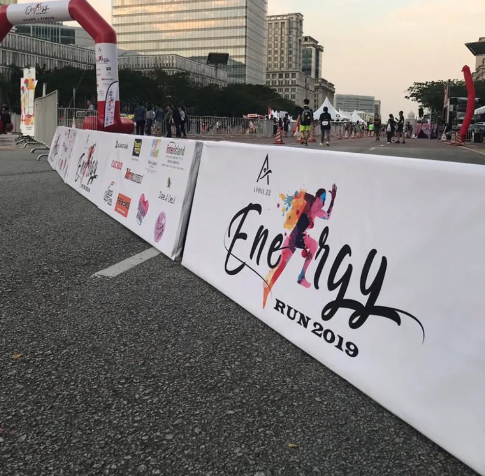 Branded A-board barriers lining a race route